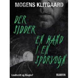 Der sidder en mand i en sporvogn