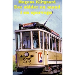Der sidder en mand i en sporvogn